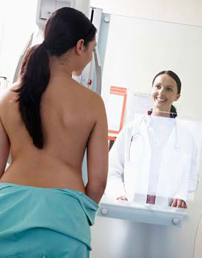 Doctor performing breast exam